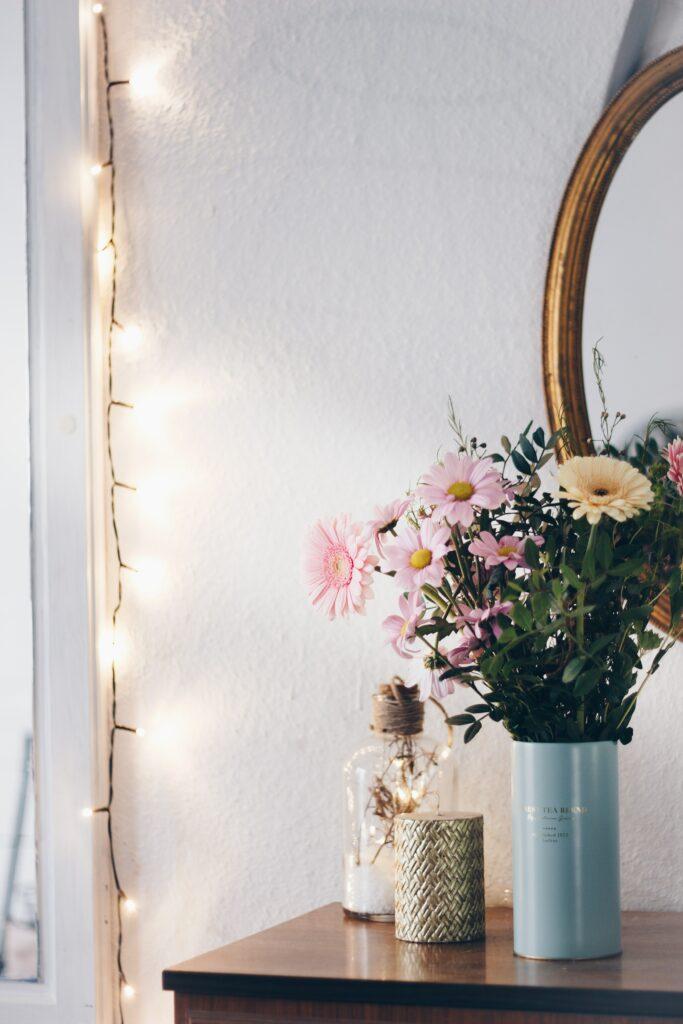 Vase with floral decor on table